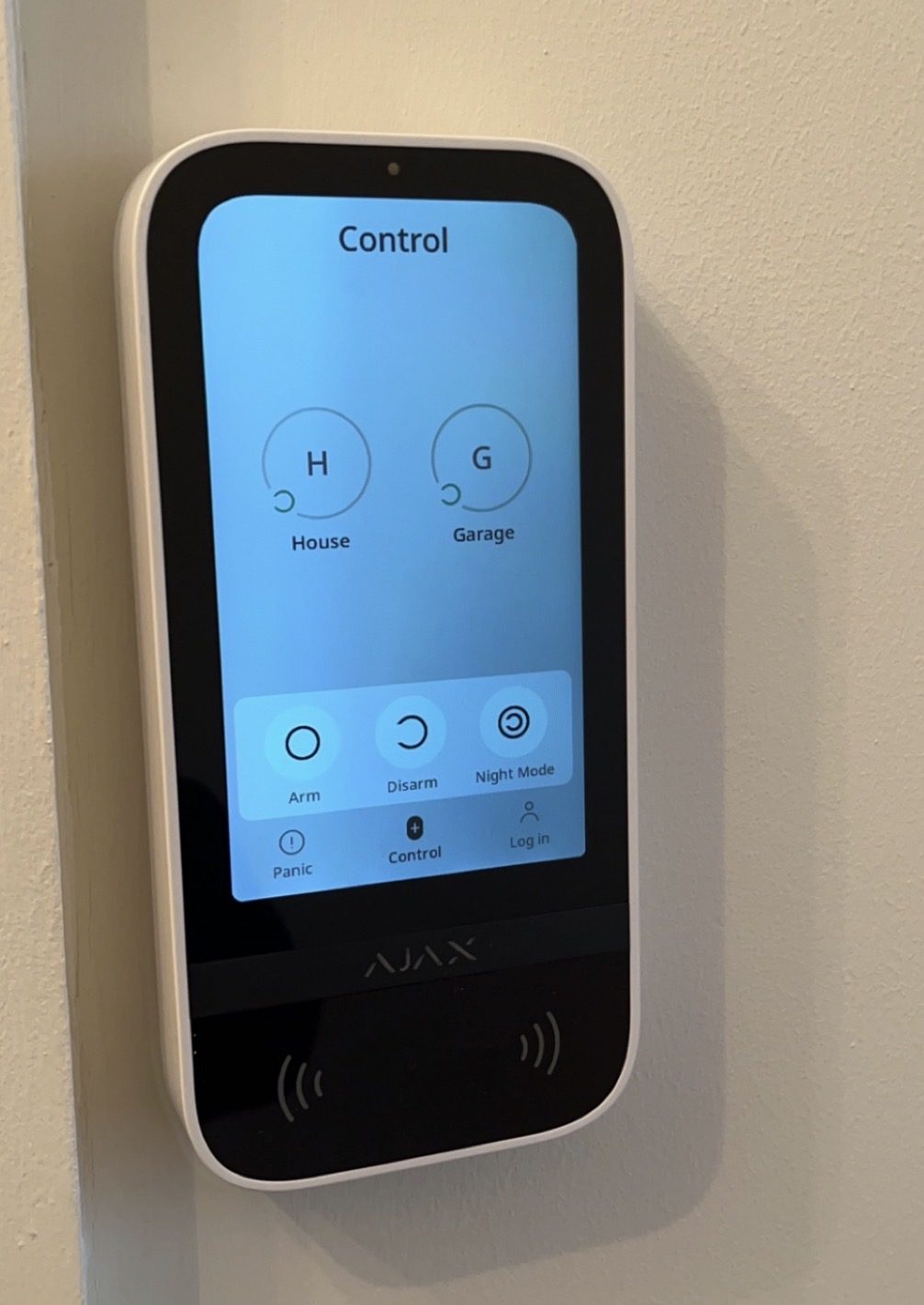 AJAX keypad touchscreen control panel installed for a home and garage